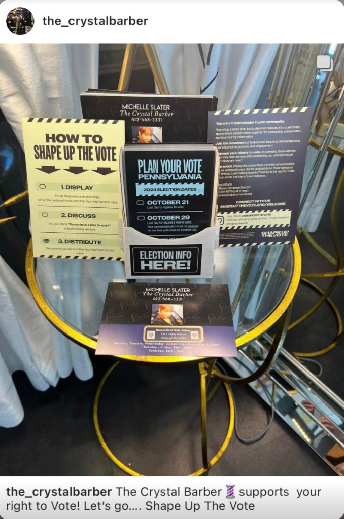 The Crystal Barber displaying a Shape Up The Vote kit with Pennsylvania voting materials
