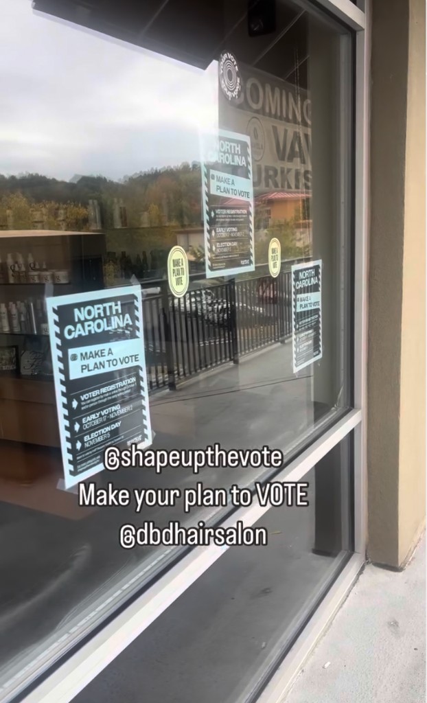 DBD Hair Salon window display with North Carolina Make a Plan to Vote posters
